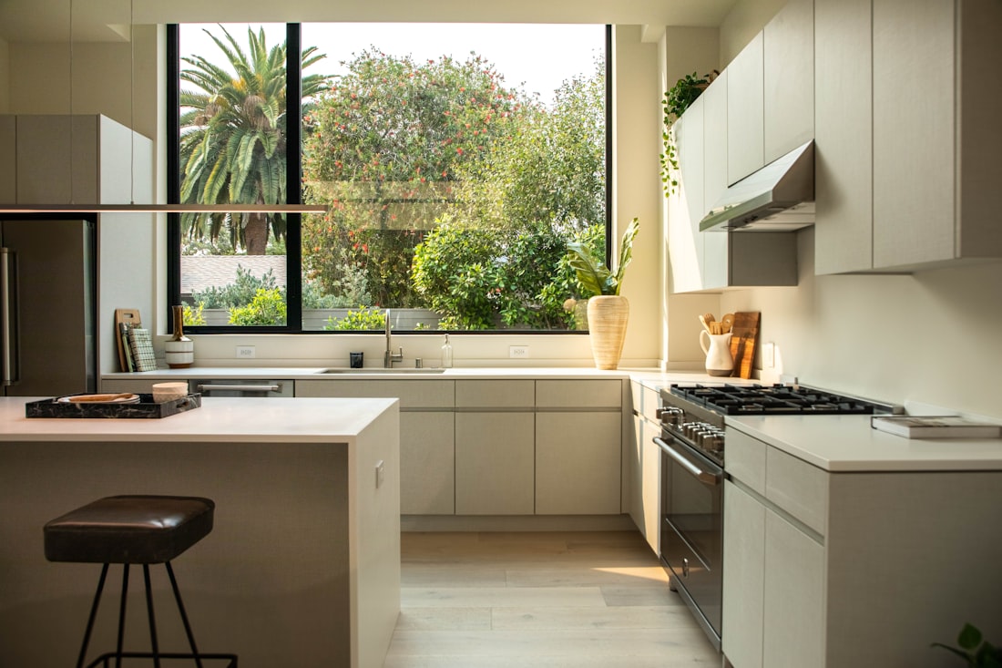 modern kitchen with island and large window