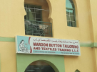 Maroon button tailoring And textile trading